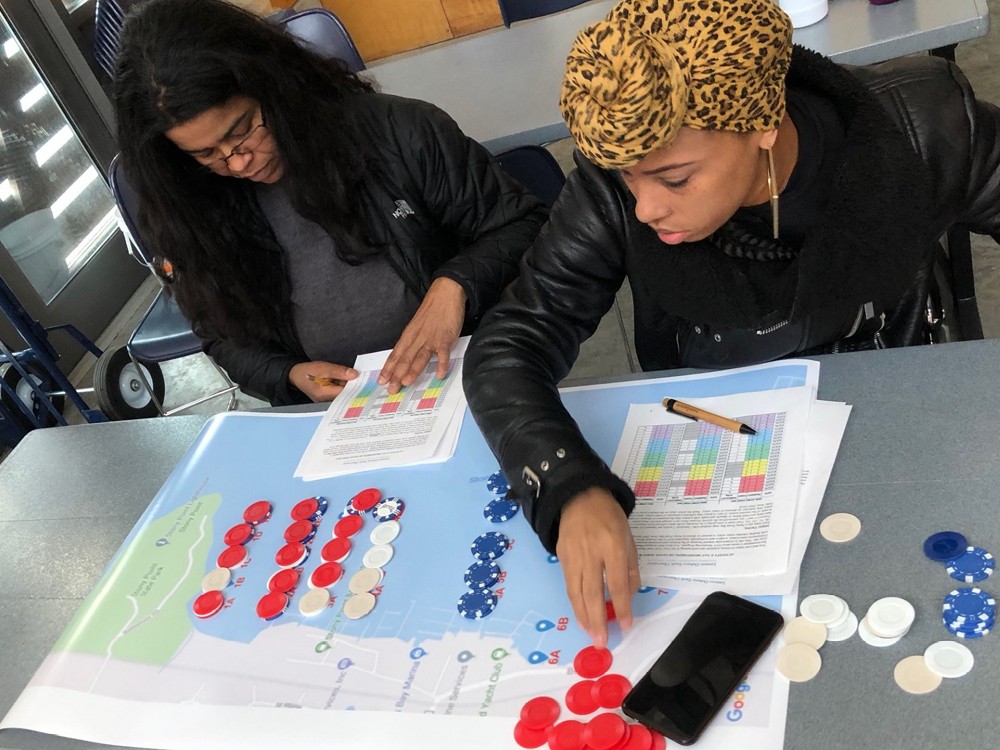 Two teachers at a table exploring a mapping activity