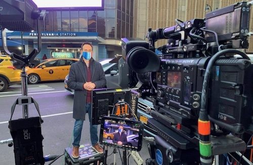 man in front of video camera