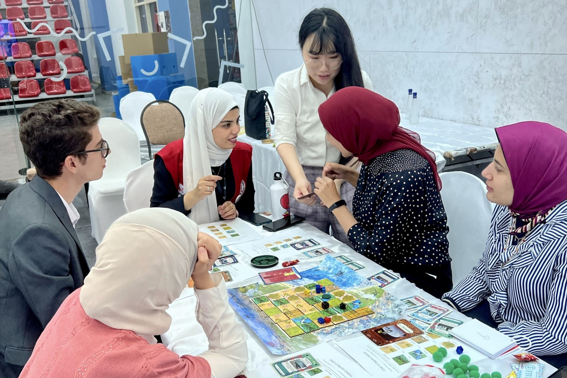 Young people testing out Planet-E at the UN Conference of Youth.