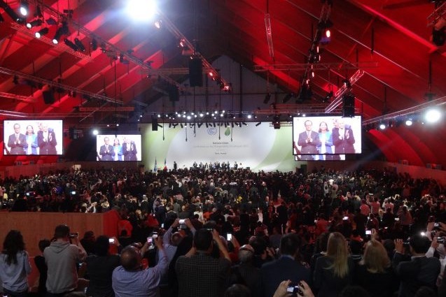 Crowd at the adoption of the Paris Agreement. Credit: Mélody Braun