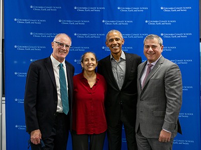 Alex Halliday, Ruth Defries, Barack Obama, and Jason Bordoff in front of blue background