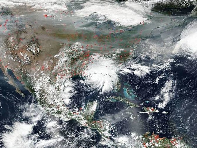 Satellite image of fires and hurricanes across the U.S. on September 15, 2020. Credit: NASA Worldview, Earth Observing System Data and Information System