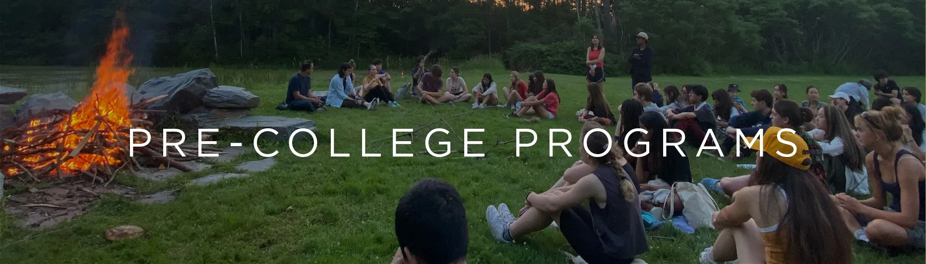 Columbia Climate School Pre-College Programs - Students around a fire.