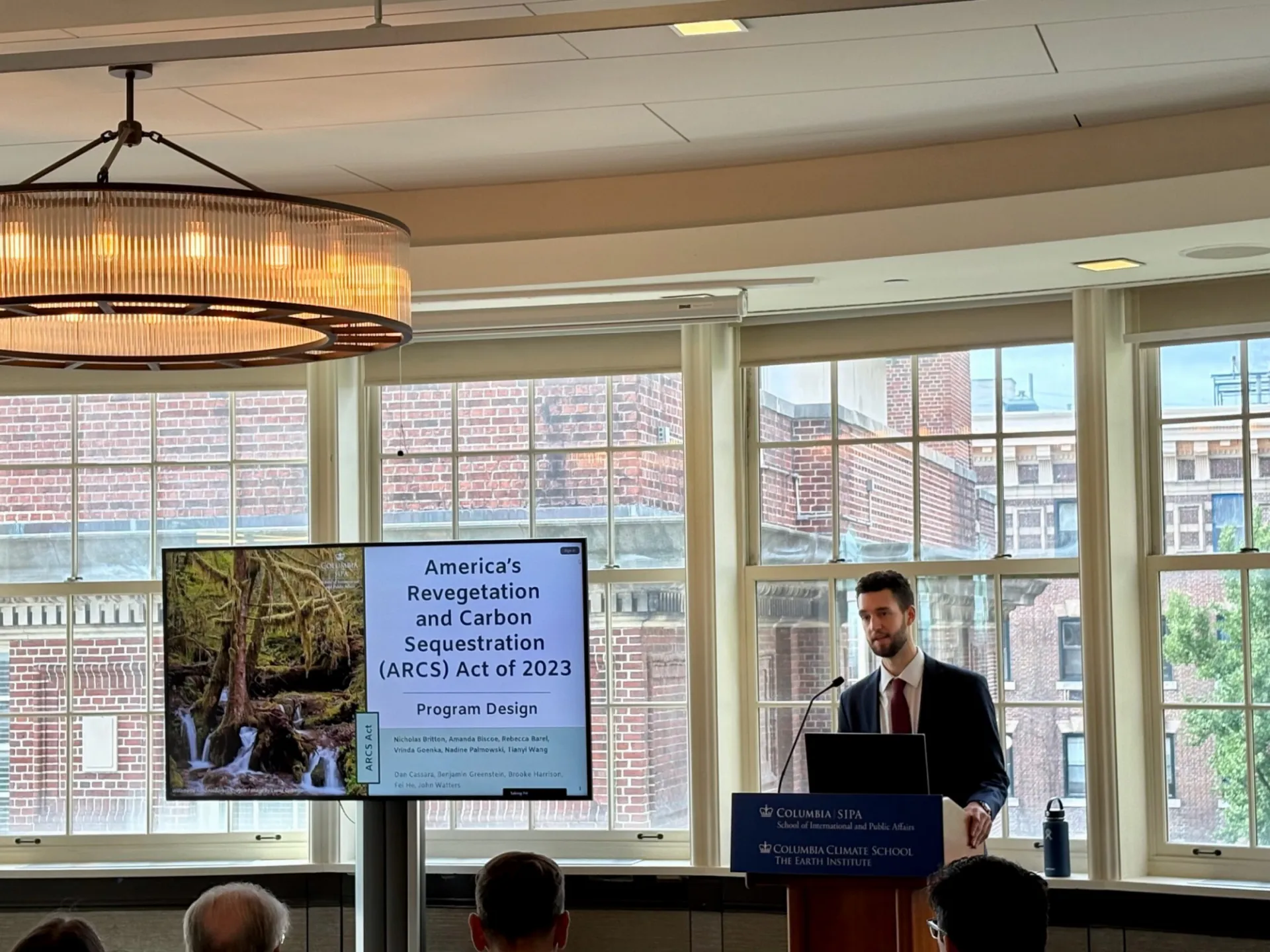 Nicholas Britton presents his fall workshop group’s midterm briefing on America’s Revegetation and Carbon Sequestration Act of 2023. Credit: Rebecca Barel