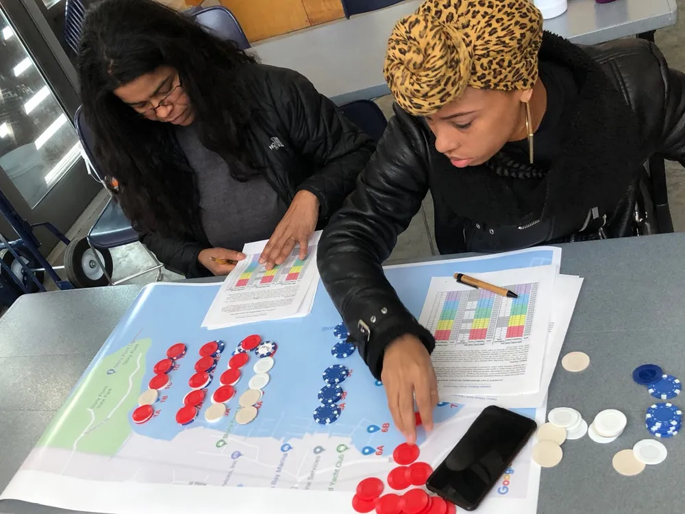 Two teachers at a table exploring a mapping activity