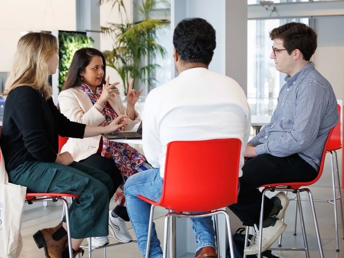 Four people around a table