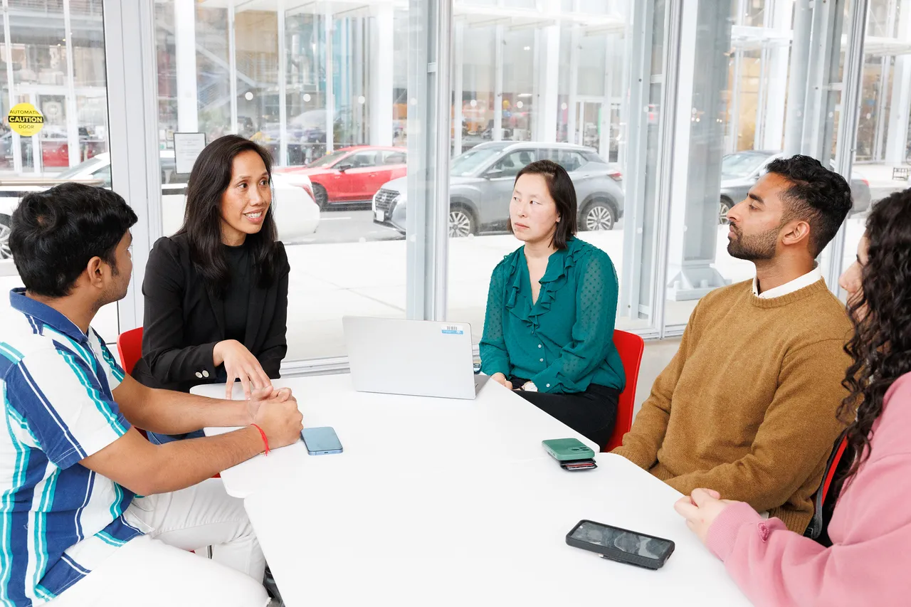 5 people around a table
