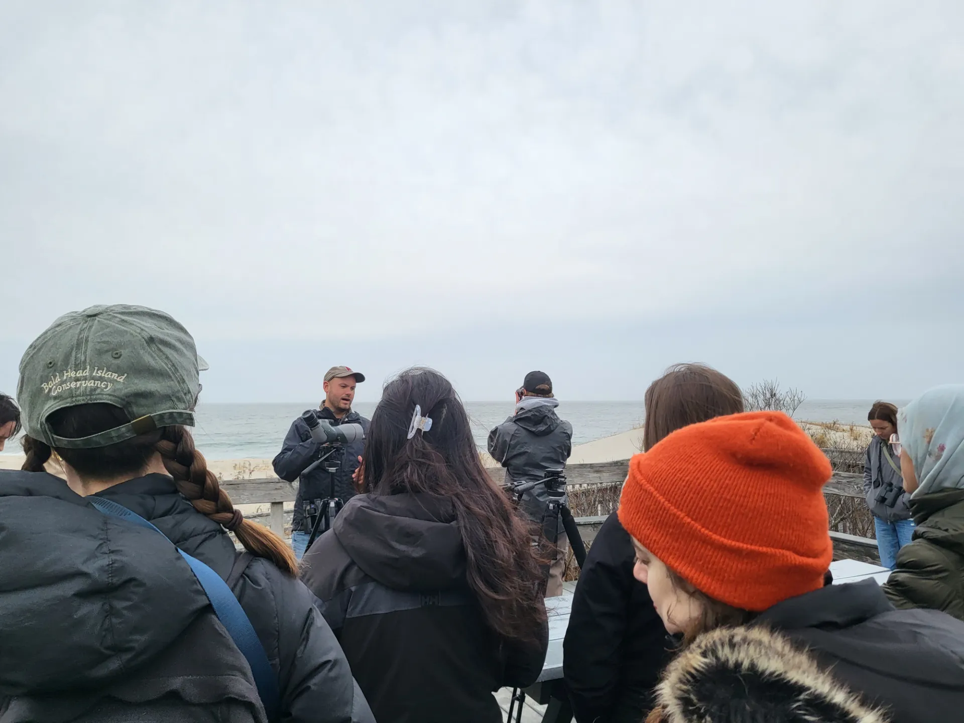 People gathered on a beach in winter
