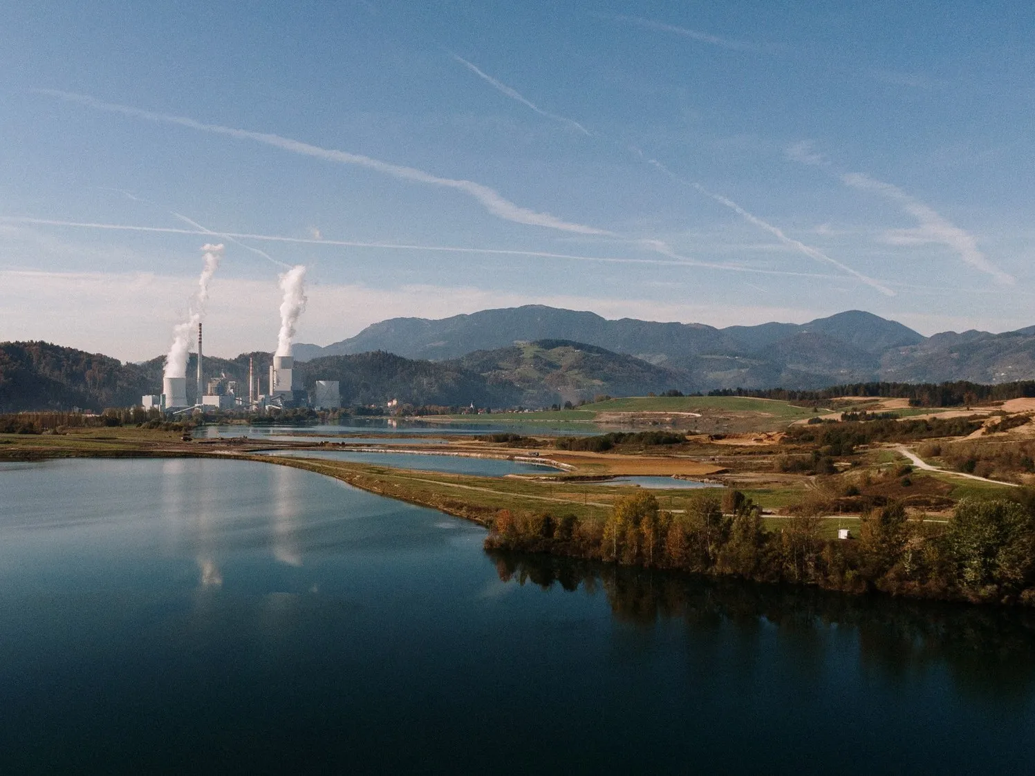 Power plant with a marsh and mountains