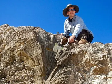 Person perched on a rocky outcrop