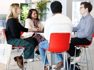Four people around a table