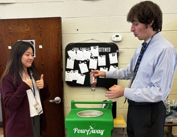 Alison Roh at school with her recycling project