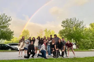 Students from the 2023 Green Mountains cohort celebrate the conclusion of an empowering program under a rainbow. Photo credit: Courtney White