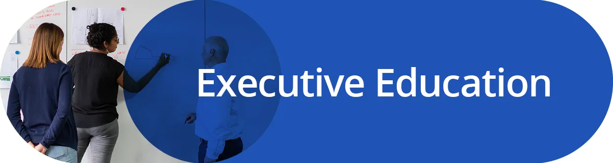 Person drawing on a white board with text Executive Education