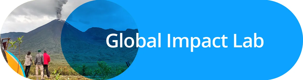 People looking at a volcano with the text Global Impact Lab