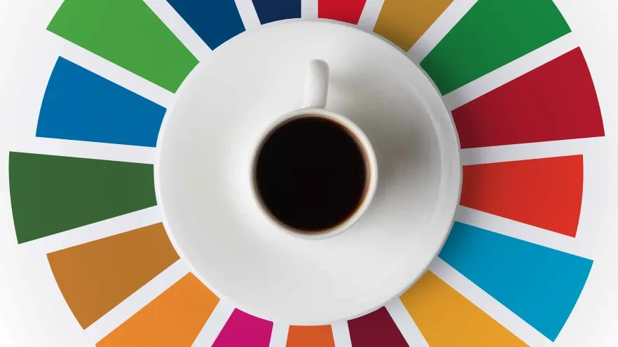A cup of coffee surrounded by colorful bars representing the Sustainable Development Goals.